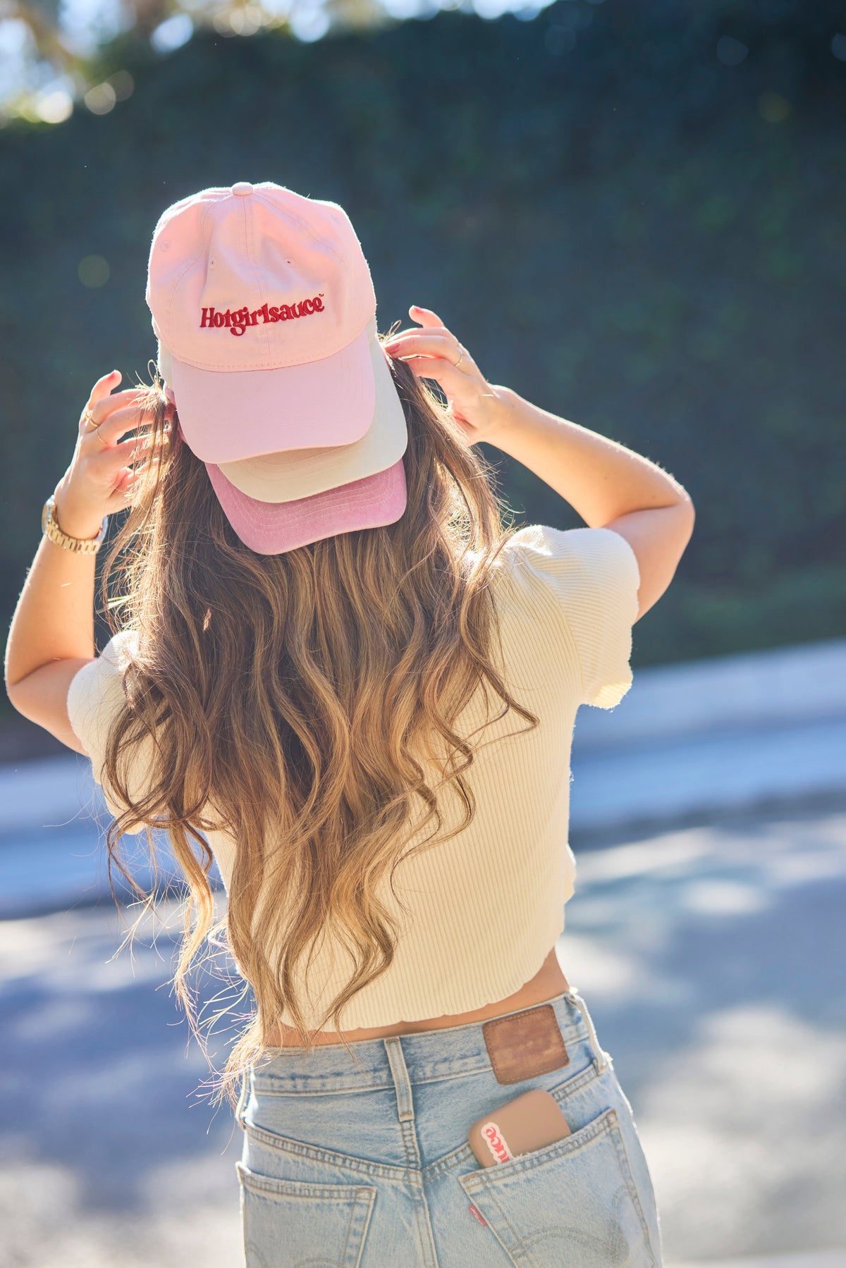 Hotgirlsauce merch collection featuring embroidered dad hats