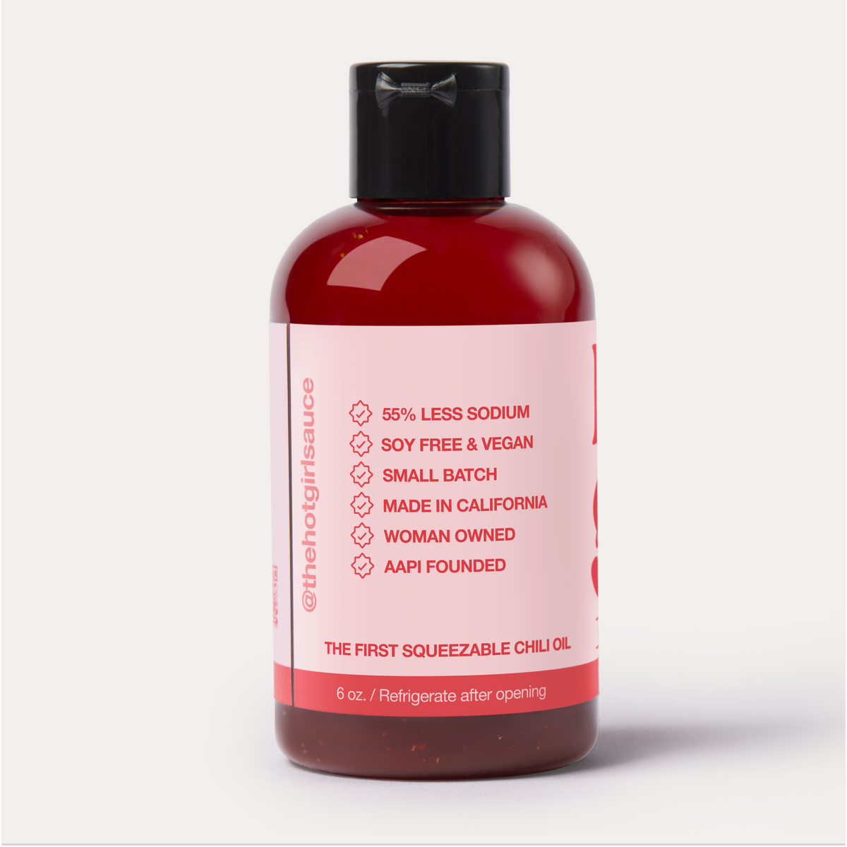 Backside of a closed bottle of OG Hot Girl Squeezable Chili Oil -  Hotgirlsauce chili oil - chili sauce - hot sauce