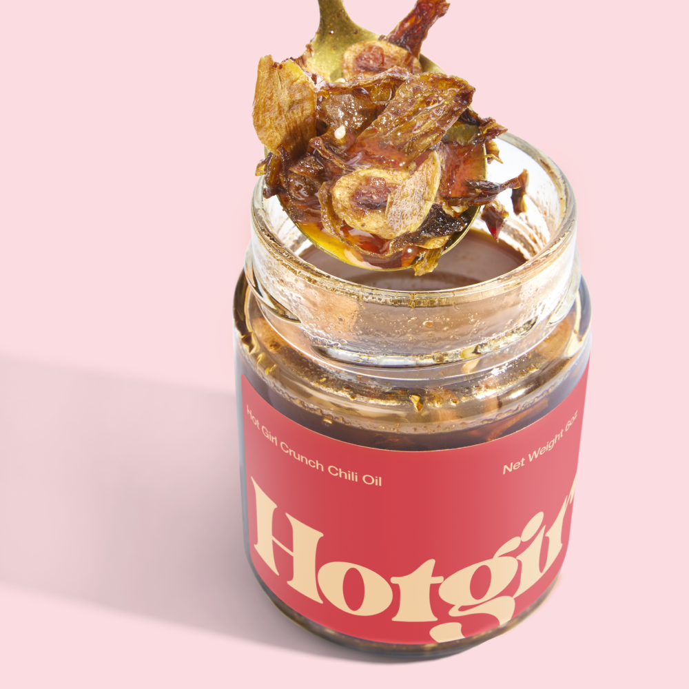 Crispy garlic and shallot crunch spooned from a jar of Hot Girl Crunch Chili Oil - Hotgirlsauce chili oil - chili crunch - hot sauce